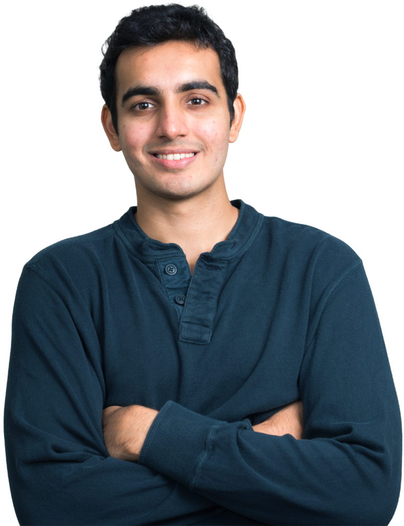 young-indian-male-arms-crossed-smiling-grey-button-shirt-1